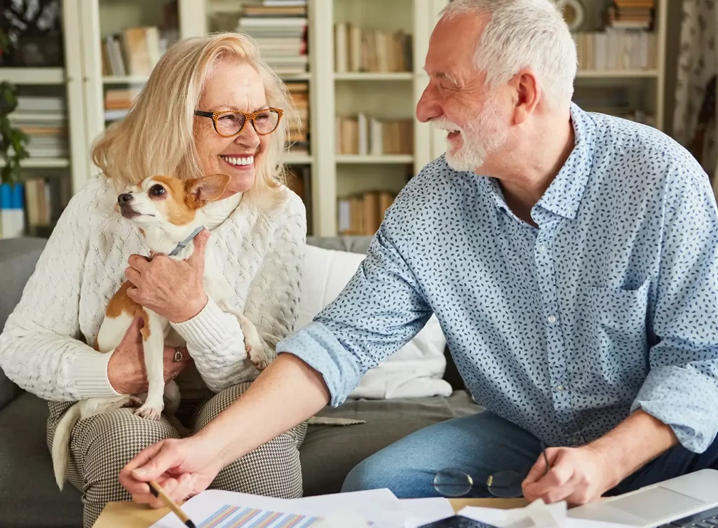 retired couple with their dog going over their annuity plans